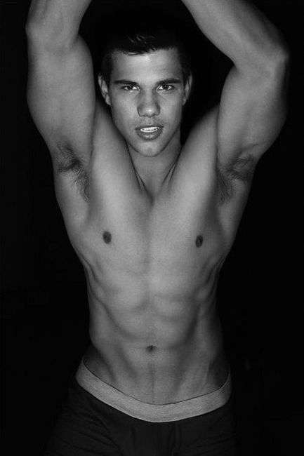 hottest pic of taylor lautner shirtless with his arms up showing off his 8 pack