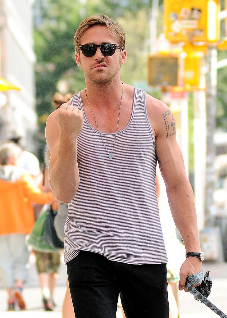 sexy pic of Ryan Gosling in tank top giving a fist sign in NYC looking fine