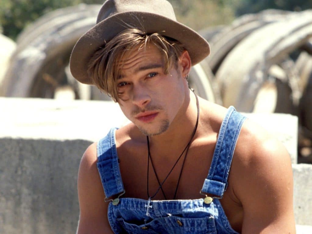 hot pic of brad pitt in overalls and a hat on