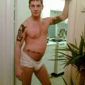 a young Tom Hardy poses with underwear and shows is package off