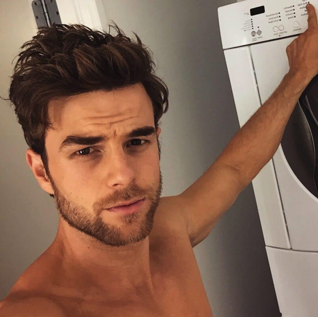 actor nathaniel buzolic looking sexy as hell shirtless by the laundry instagram pic