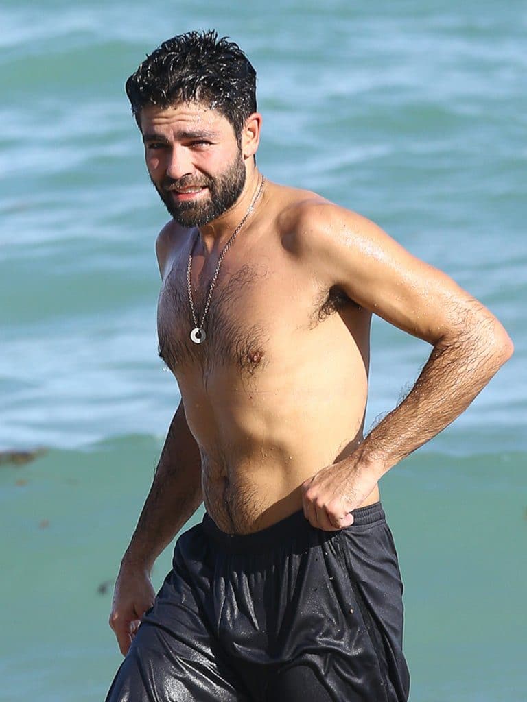 celebrity star adrian grenier nude chest and shirtless on the beach in miami with a hairy chest