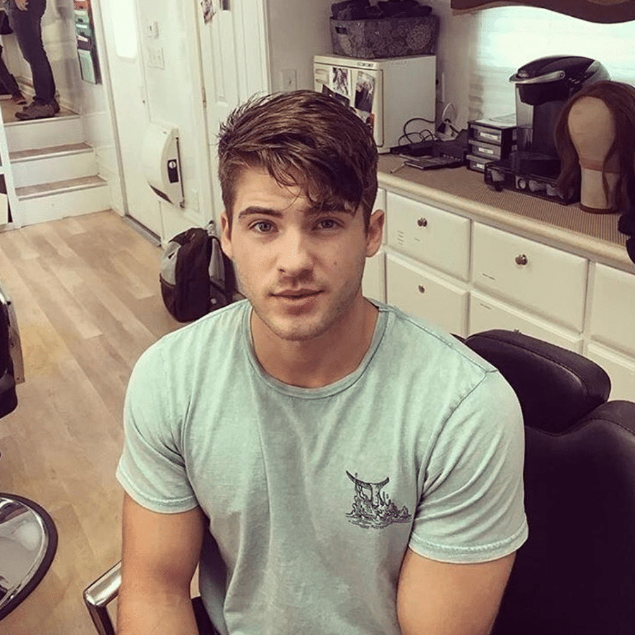 Cody Christian, the teen wolf actor, posted an instagram photo showing off his biceps in a tight shirt