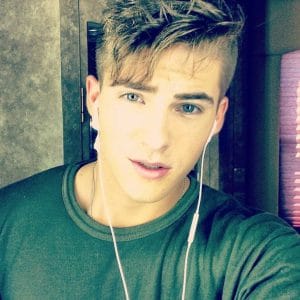 hot selfie of cody christian with ear phones in