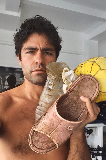 actor adrian grenier taking a selfie shirtless