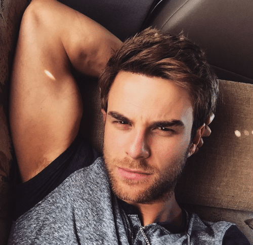 hot pic of nathaniel buzolic taking a selfie showing off his bicep and giving a fierce sexy look