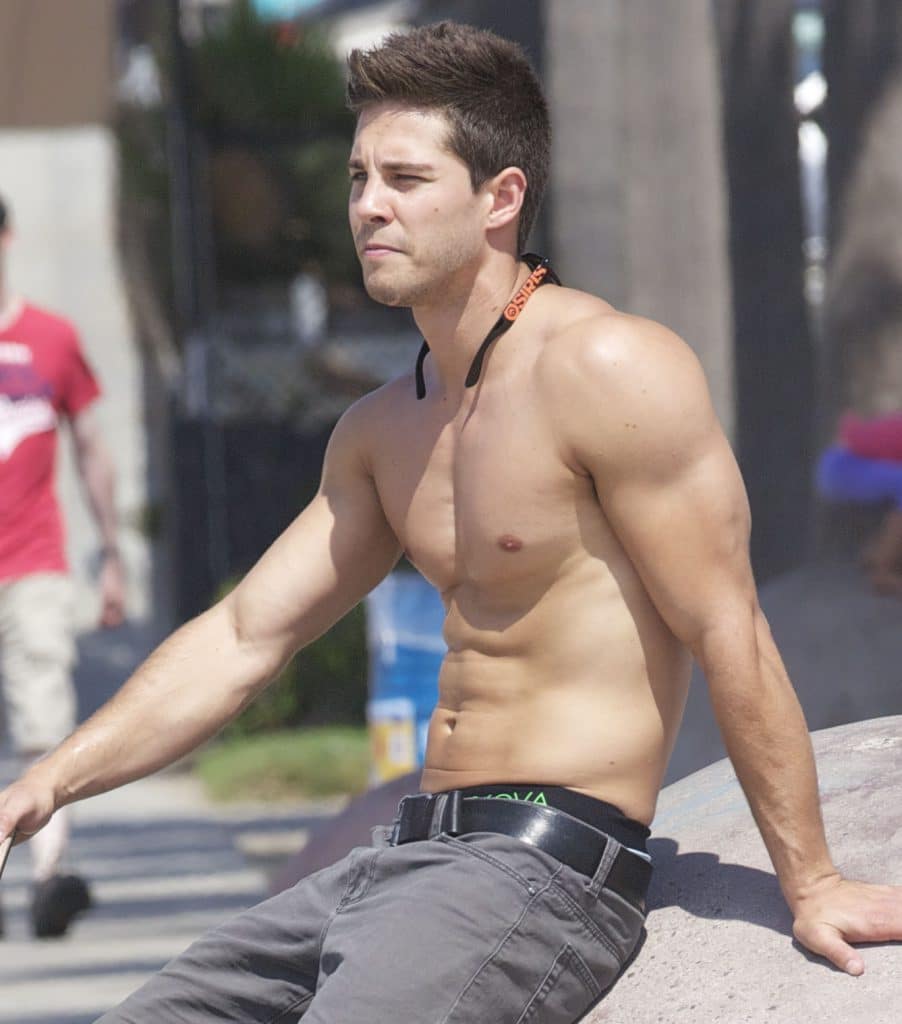 Dean Geyer ripped shirtless outdoors