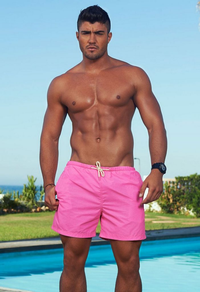 Rogan O'connor in a pink swimsuit