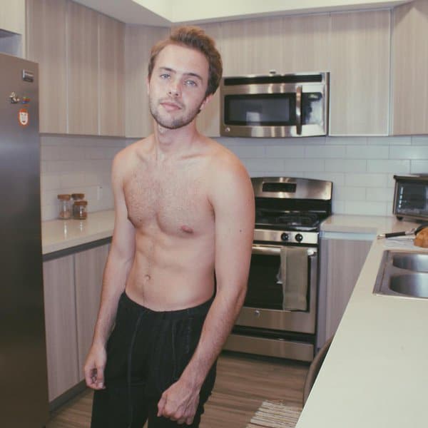 Ryland Adams in the kitchen with no shirt